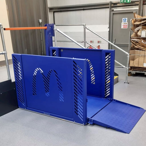 Blue goods platform lift with a McDonalds logo