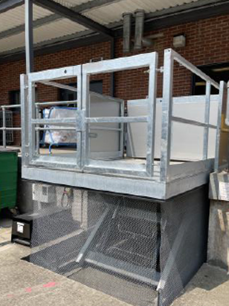 A sturdy metal lift in a loading bay